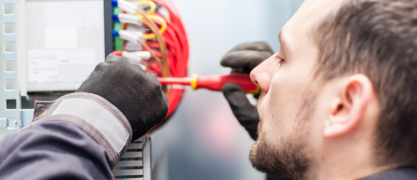 Worker fixing an electrical box.