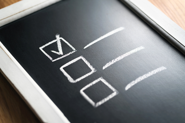 Chalkboard with squares and a checkmark.